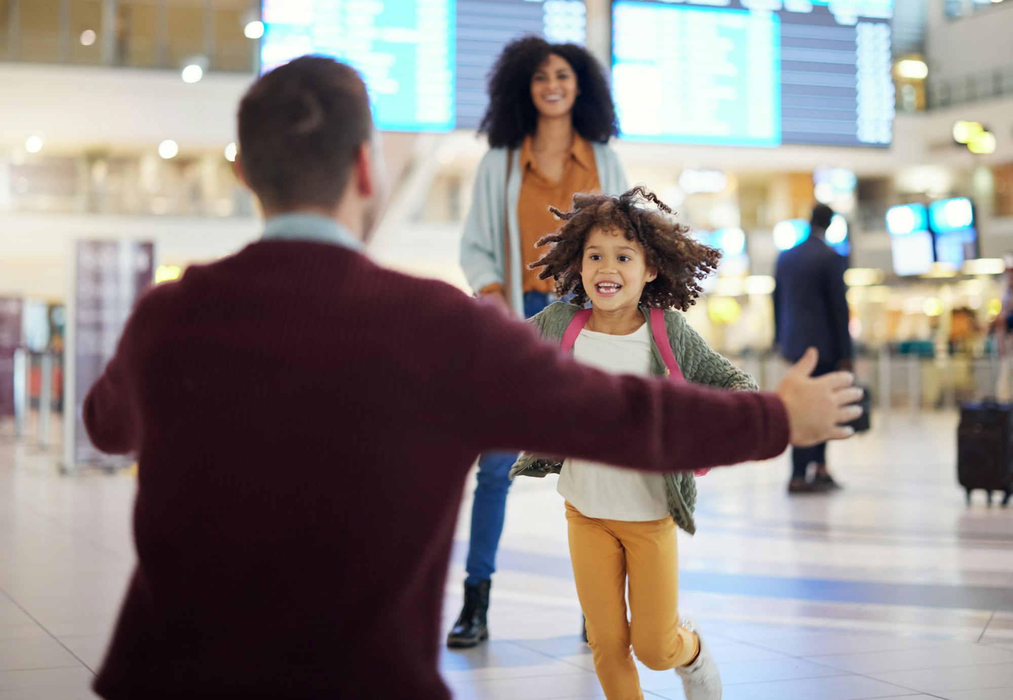 Happy child running to father at airport for welcome home travel and reunion, immigration or intern