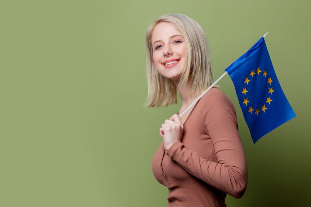 Beautiful woman with flag of Europe Union