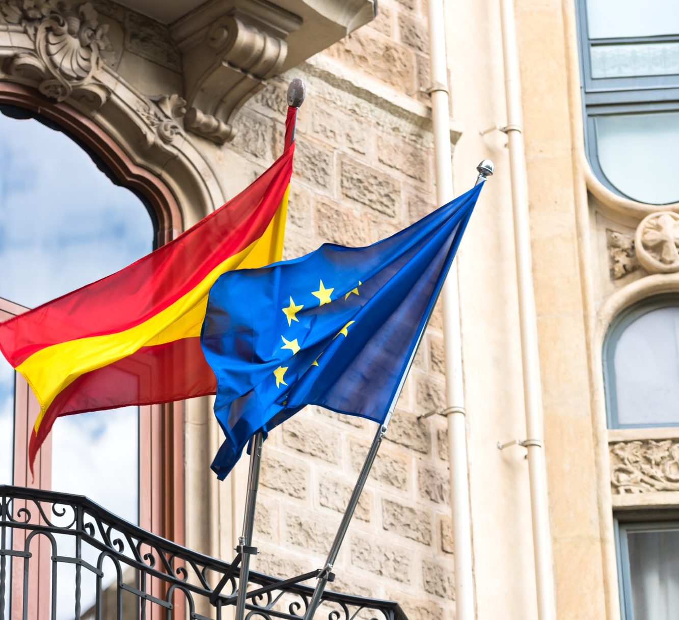 Flags of Spain and United Europe on balcony